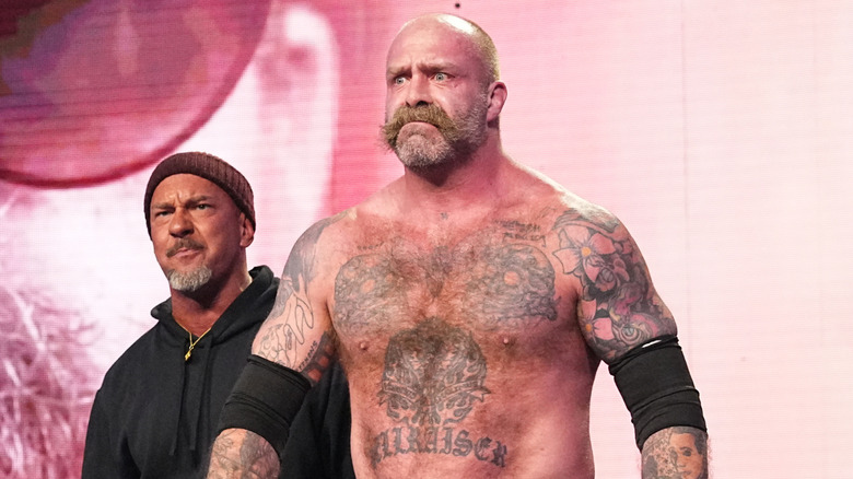 The Butcher AKA Andy Williams making his AEW entrance alongside The Blade