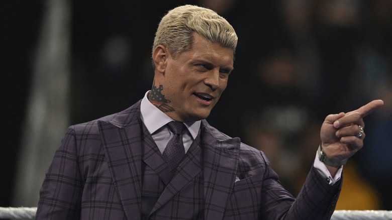 Cody Rhodes stands in the ring pointing during an episode of 
