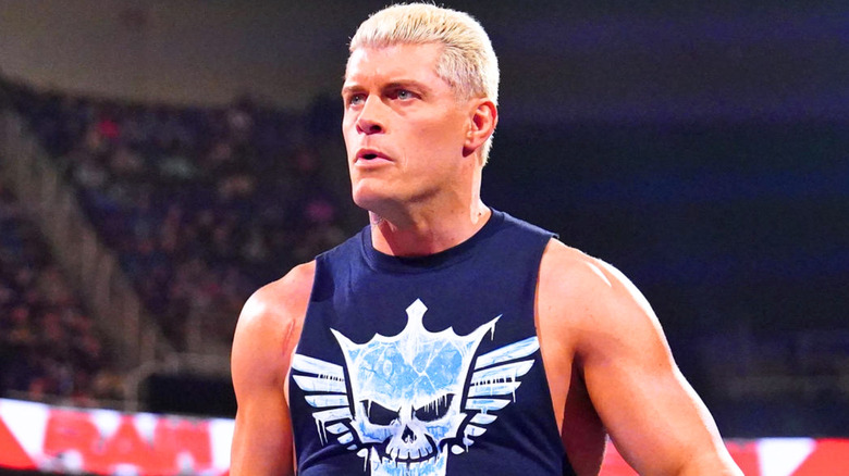 Cody Rhodes wearing a navy blue tank top