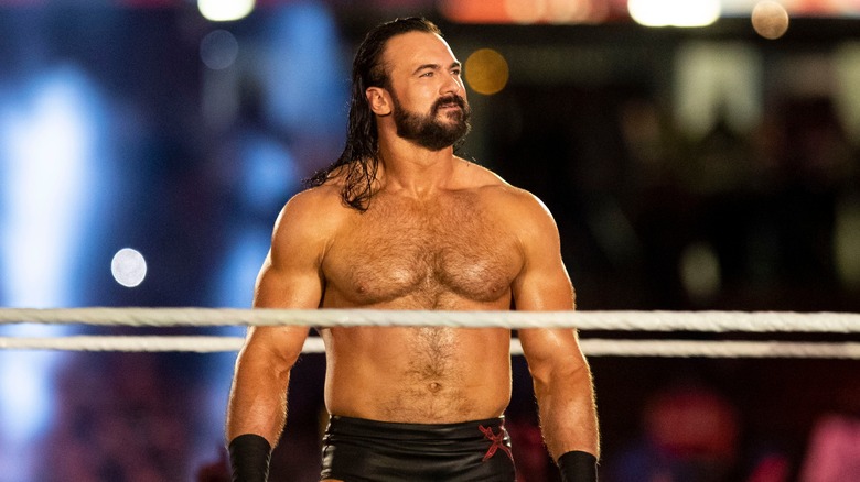 Drew McIntyre smiles in the ring 