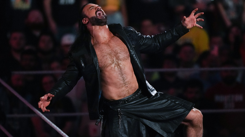 Drew McIntyre posing in the ring