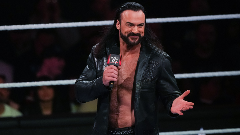 Drew McIntyre shrugging and smiling