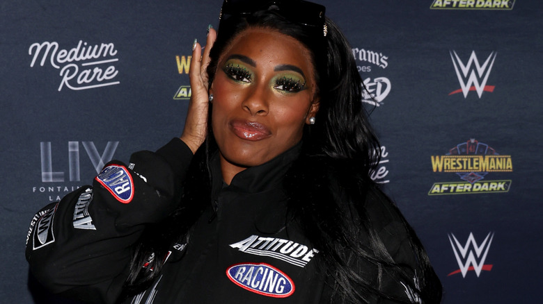 Lash Legend wearing a black jacket