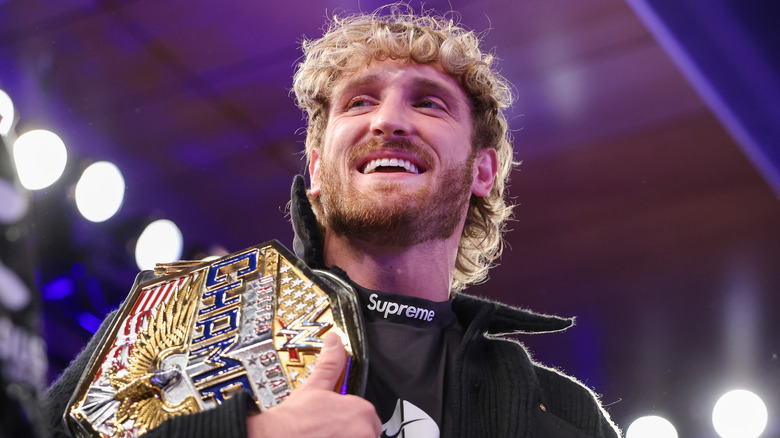 Logan Paul holding WWE United States Championship