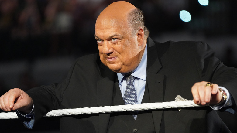 Paul Heyman leaning on the ring ropes