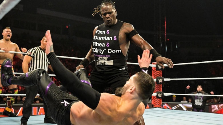 R-Truth knocks Finn Balor to the mat