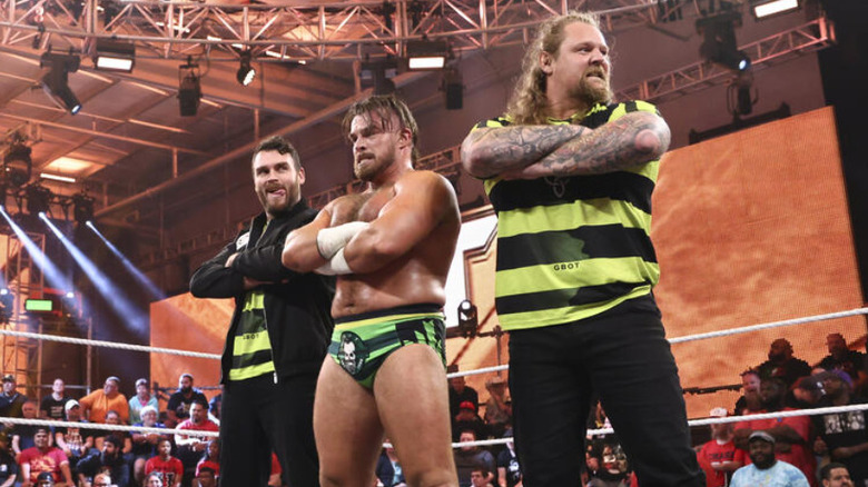 Mark Coffey, Joe Coffey, and Wolfgang standing in the ring