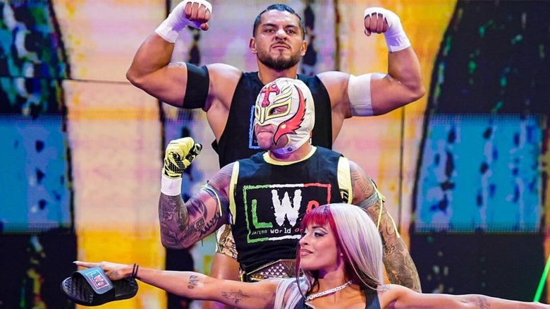 Santos Escobar, Rey Mysterio, and Zelina Vega as the LWO.