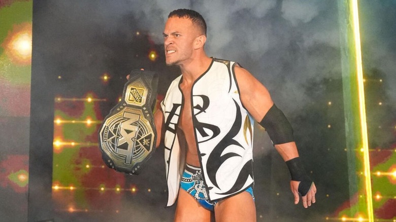 Then-NXT Champion Ricky Saints makes his entrance at Deadline, posing with the title on the stage.