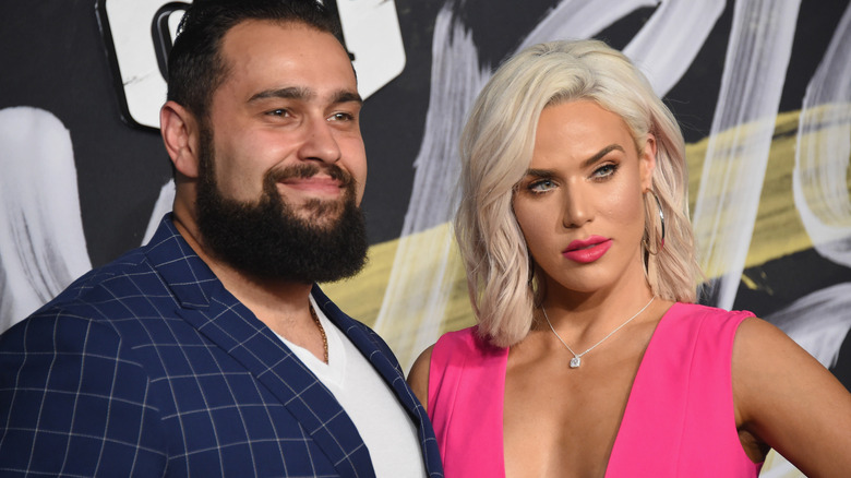 Rusev and CJ Perry standing beside one another