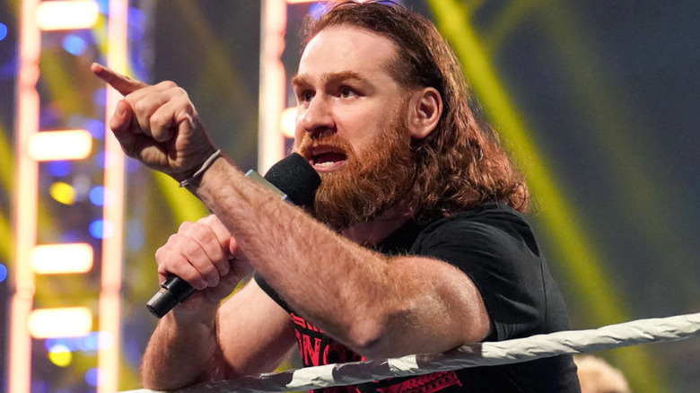 Sami Zayn talking in a microphone