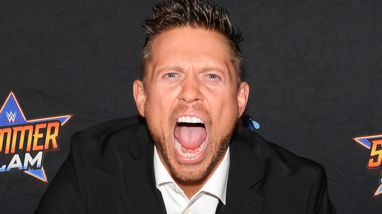the miz posing on the red carpet