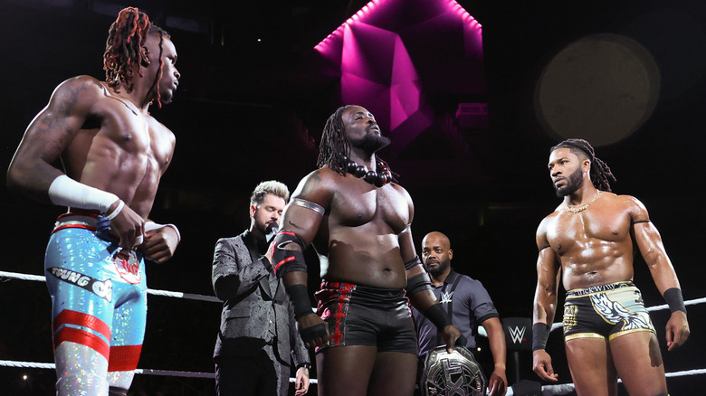 Je'Von Evans, Oba Femi and Trick Williams in the ring together
