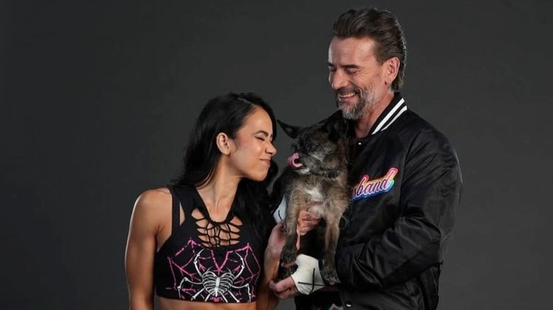 CM Punk, AJ Lee, and Larry