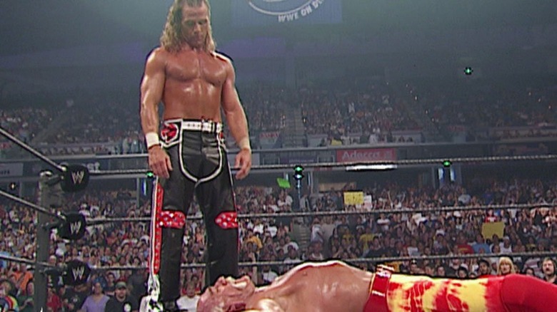 Shawn Michaels looks down at Hulk Hogan