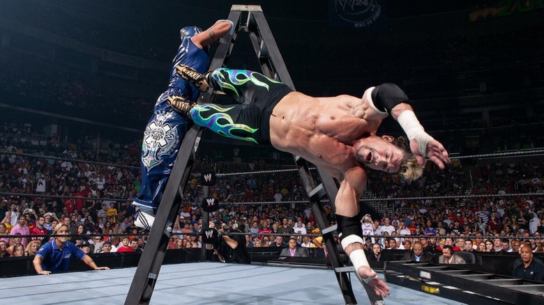 Eddie Guerrero and Rey Mysterio fight in a ladder match