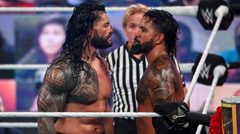 Roman Reigns and Jey Uso stare at each other