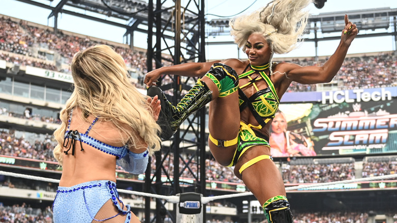 Jade Cargill looks to flatten Tiffany Stratton with a Big Boot.