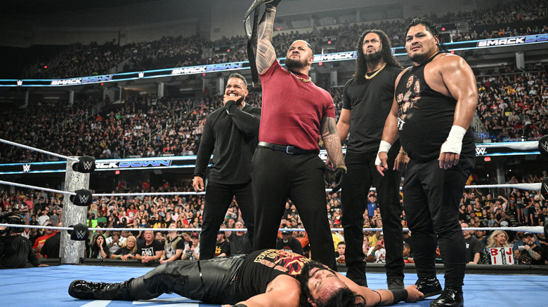 Solo Sikoa and The MFT stand over Jacob Fatu