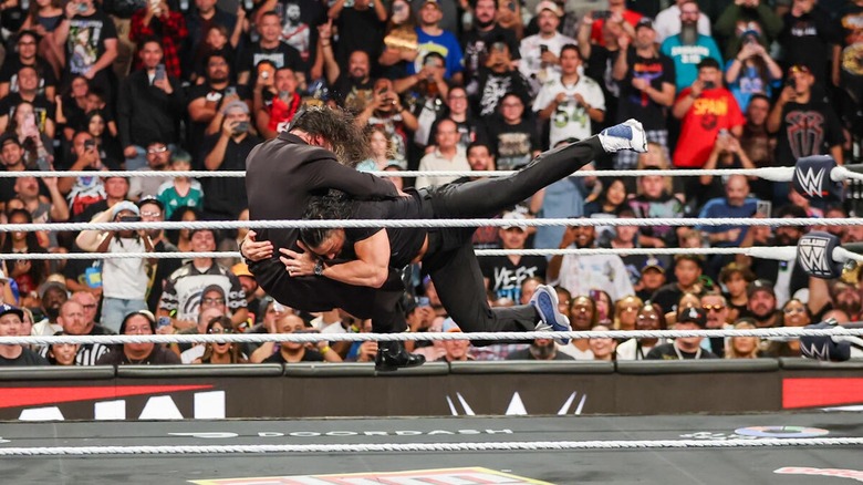 Roman Reigns spears Seth Rollins on "WWE Raw"
