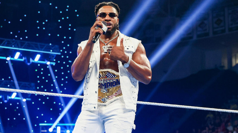 Trick Williams speaks into a microphone on "WWE SmackDown"