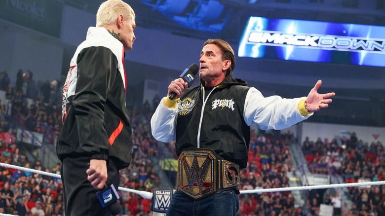Undisputed WWE Champion CM Punk raises his arms in exasperation during an in-ring promo segment alongside Cody Rhodes on the July 31, 2026 edition of 