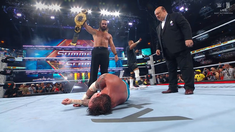 Rollins standing tall about Punk and holding up the World Heavyweight Championship