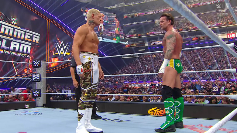 Rhodes and Punk staring one another down