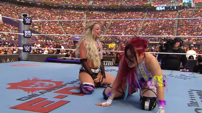 Morgan and SKY both kneeling in the ring