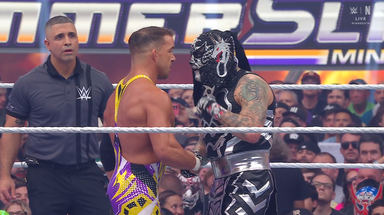 The two men shaking hands in the ring