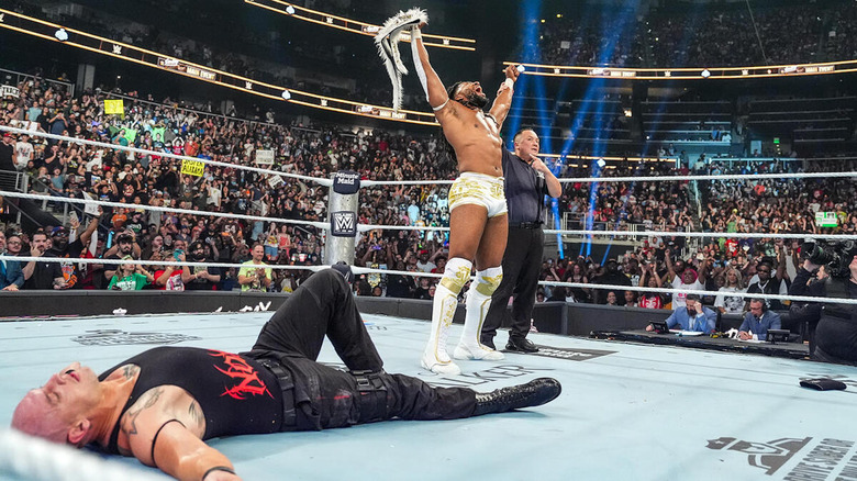 Trick Williams celebrates his win over a fallen Baron Corbin