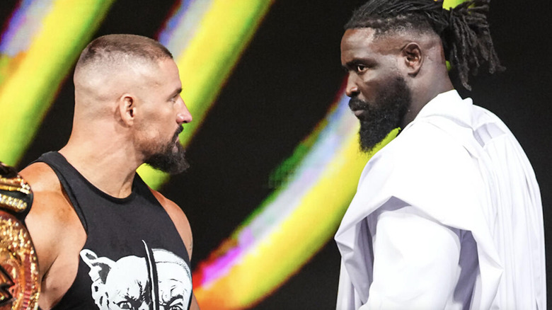 Breakker and Femi staring down one another on the top of the entrance ramp