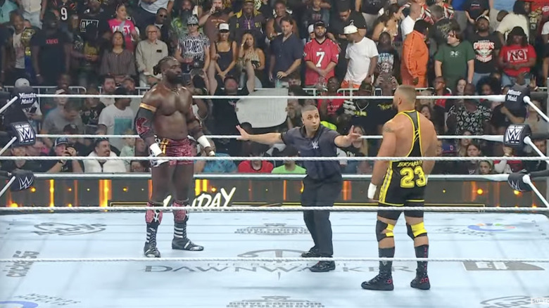 Corbin and Breakker staring down one another in the ring