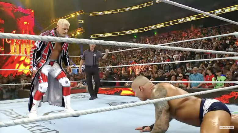 Rhodes staring down Orton from inside the ring