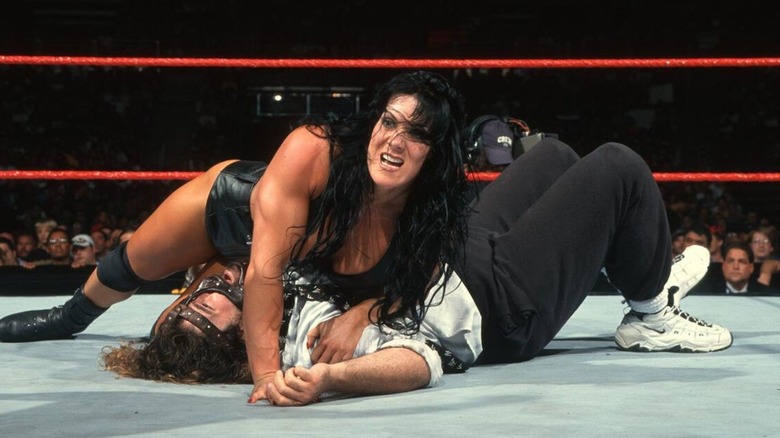 Chyna covers Mankind to become the first-ever female number one contender to the WWF Championship.