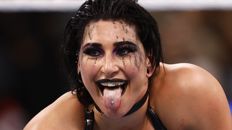 Rhea Ripley sticking out her tongue during a match.
