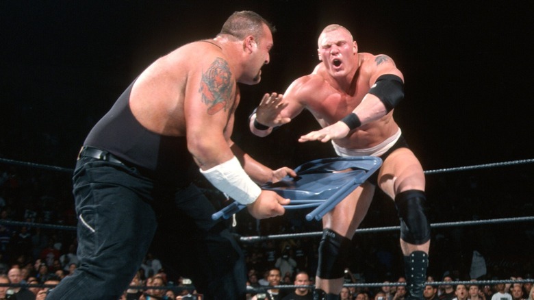 Big Show hits Brock Lesnar with a chair