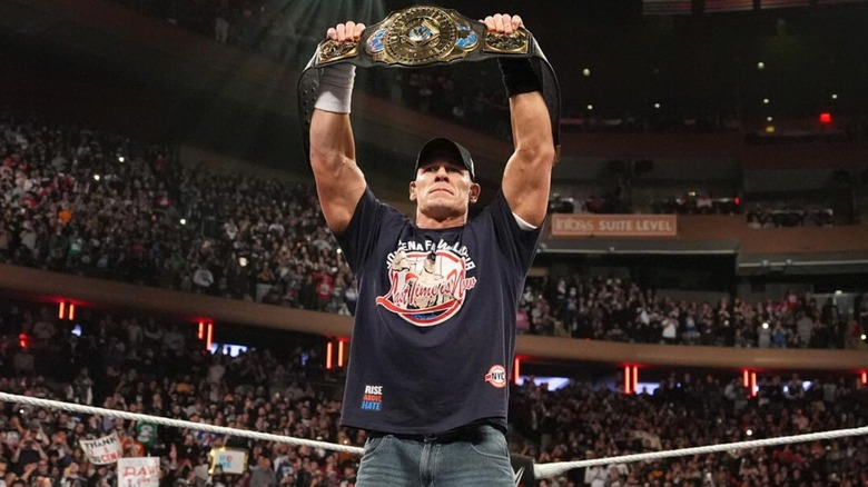 John Cena holds up the Intercontinental Championship to open an episode of "WWE Raw."