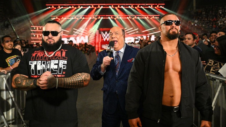 Paul Heyman cuts a promo, flanked by Bron Breakker and Bronson Reed, on an episode of "WWE Raw."