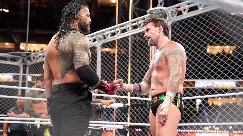 Roman Reigns bumps fists with CM Punk at WWE Survivor Series: WarGames