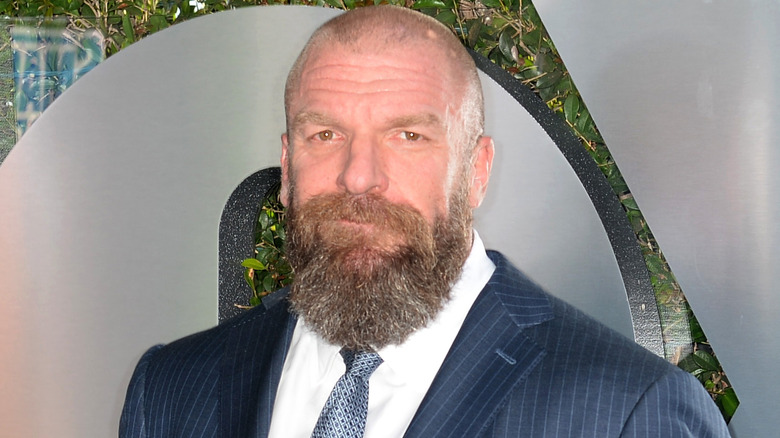 Triple H grinning