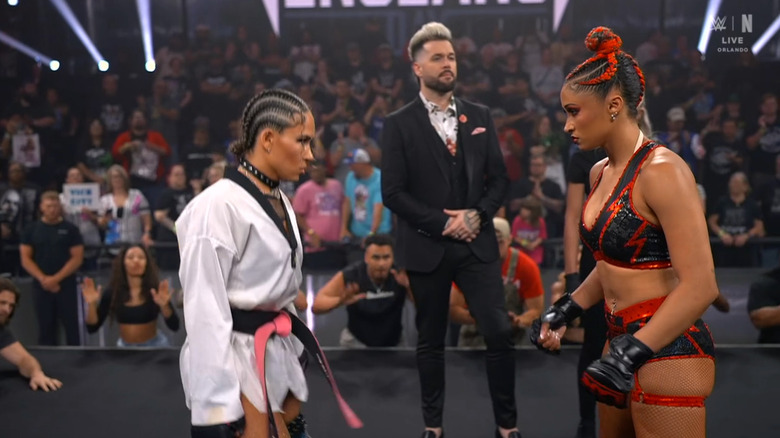 Vice and Jordan staring down one another in the ring