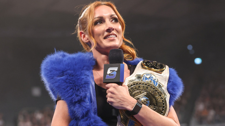 Becky Lynch holding a microphone