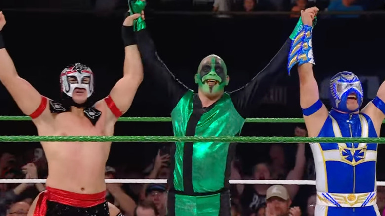 Octagon Jr., Mr. Iguana and Aero Star celebrate in the ring after winning the opening match at WWE Worlds Collide on June 7, 2025.