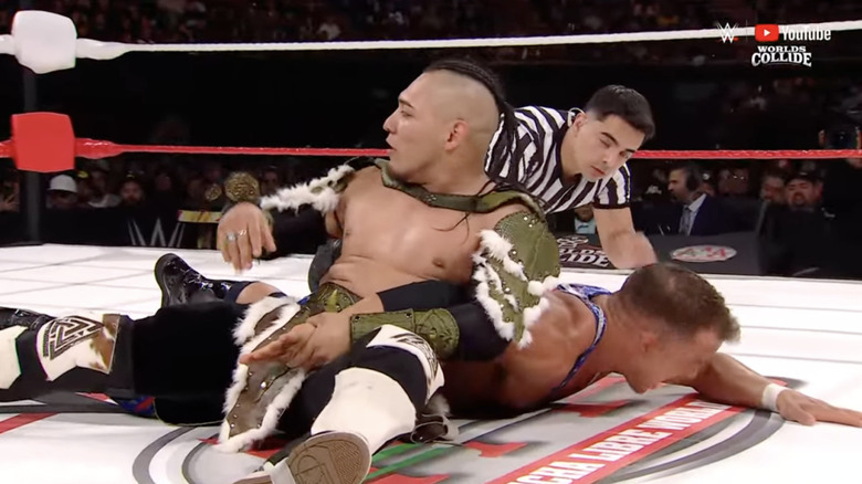 Vikingo with an arm submission locked in on Gable