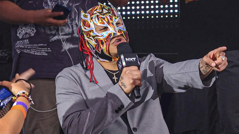 Fenix speaking on the microphone
