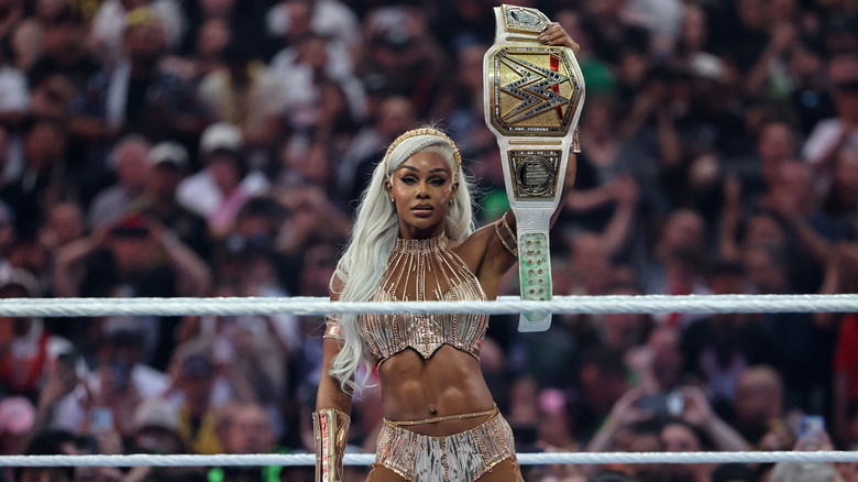 Jade Cargill holds up the WWE Women's Championship