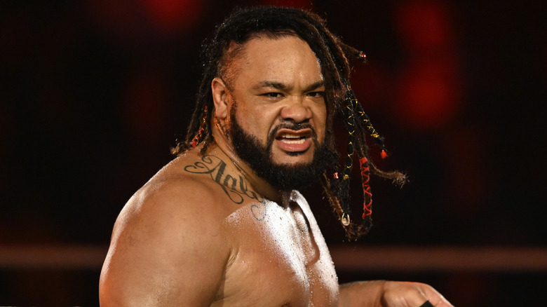 Jacob Fatu bares his teeth during his entrance.