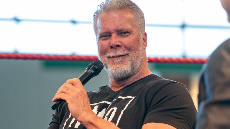 Kevin Nash holding a microphone