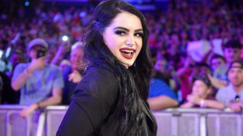 Paige makes her way down the ramp to the ring during an episode of WWE programming.